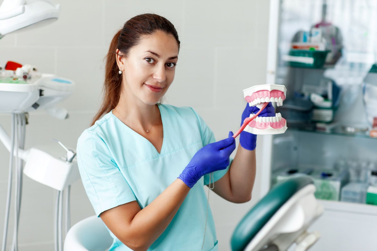 female-dentist-holding-a-sample-of-jaw-teeth-in-a-2024-09-23-01-23-44-utc.jpg